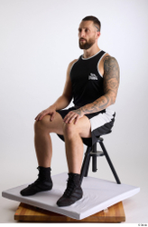 Whole Body Man White Sports Shorts Slim Athletic Sitting Top Studio photo references